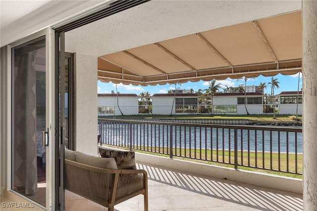 balcony featuring a water view