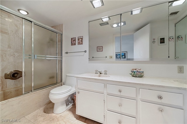 full bathroom with toilet, enclosed tub / shower combo, tile patterned floors, and vanity