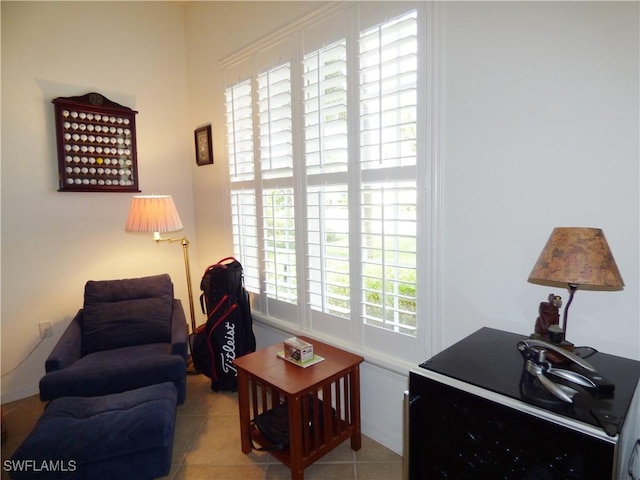 sitting room with light tile patterned floors