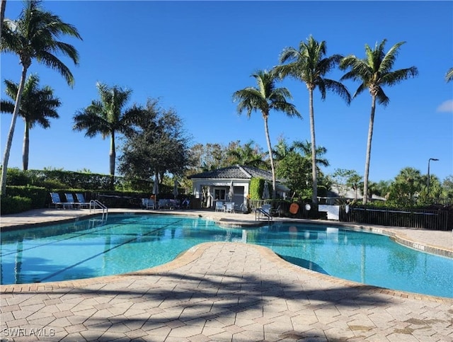 view of swimming pool with a patio area and an outdoor structure