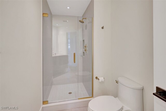 full bathroom featuring recessed lighting, toilet, and a shower stall