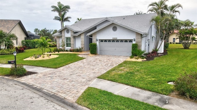 ranch-style house with a front lawn and a garage