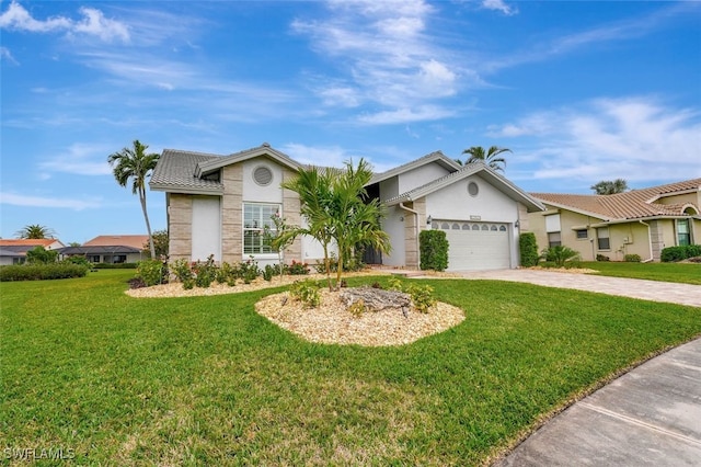 ranch-style home featuring a front yard and a garage