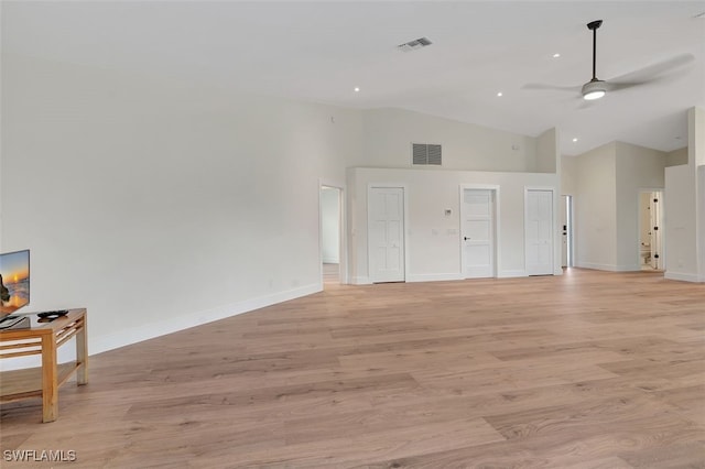 living room with ceiling fan, high vaulted ceiling, and light wood-type flooring