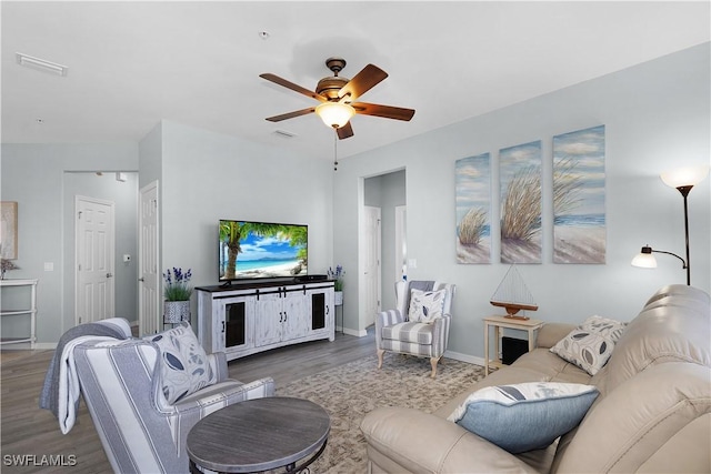 living room with ceiling fan and hardwood / wood-style floors