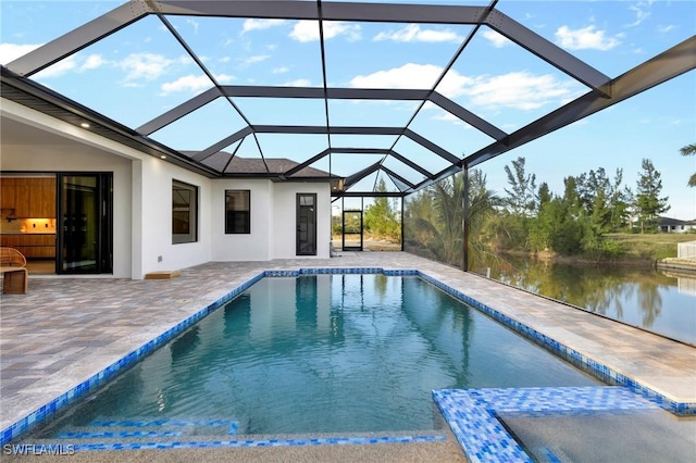 view of pool with a water view, a lanai, and a patio area