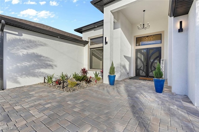 property entrance featuring french doors and a patio