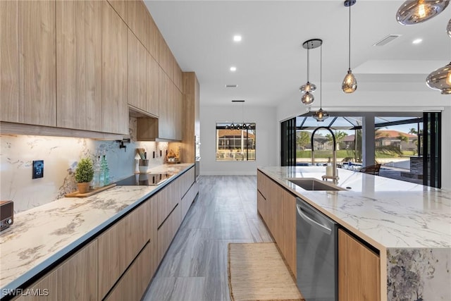 kitchen featuring a large island, sink, dishwasher, hanging light fixtures, and light brown cabinets