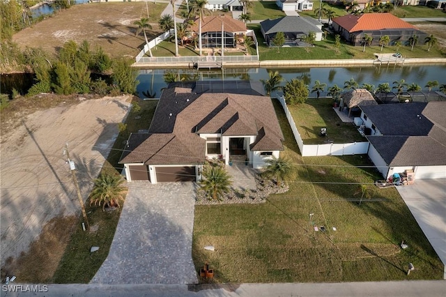 birds eye view of property featuring a water view