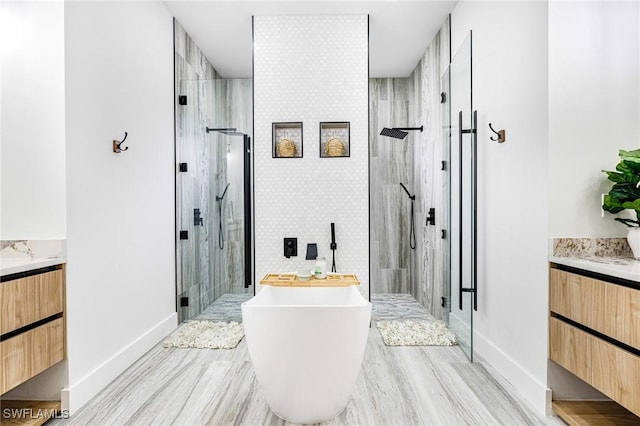 bathroom featuring hardwood / wood-style flooring, plus walk in shower, and vanity