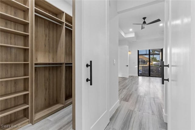 walk in closet featuring ceiling fan