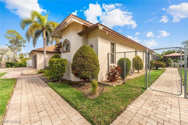 view of side of property with a garage