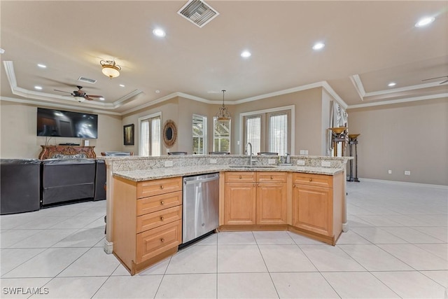 kitchen with light stone countertops, an island with sink, sink, ornamental molding, and stainless steel dishwasher