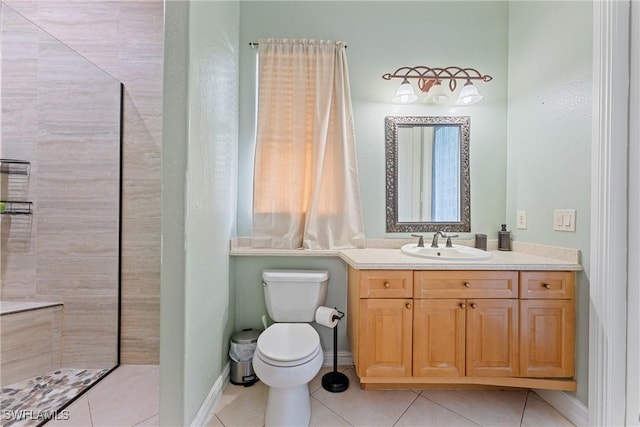 bathroom with tile patterned floors, vanity, and toilet