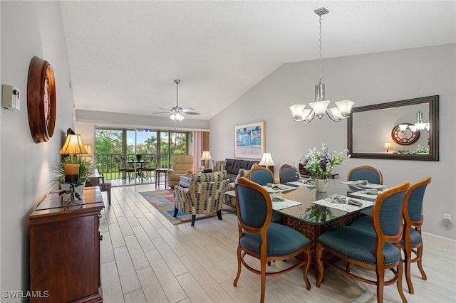 dining space featuring light wood-type flooring, vaulted ceiling, and ceiling fan with notable chandelier