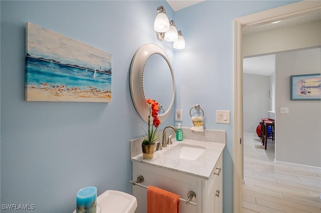 bathroom with wood-type flooring and vanity