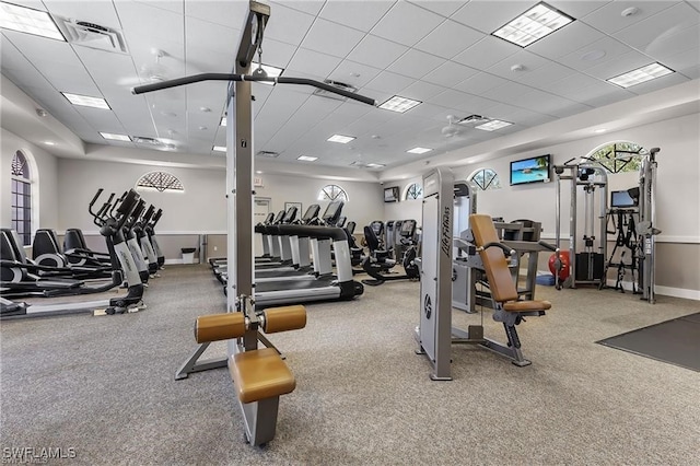 workout area featuring a paneled ceiling