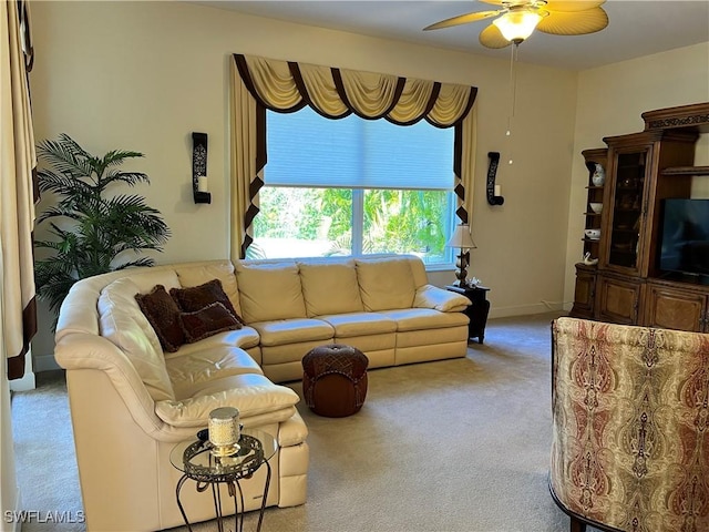 living room featuring ceiling fan and light colored carpet