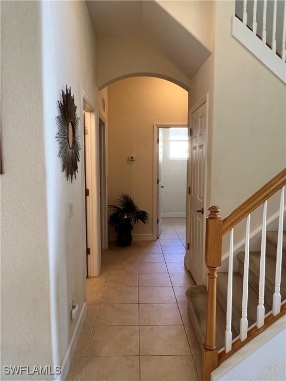 hall with light tile patterned flooring