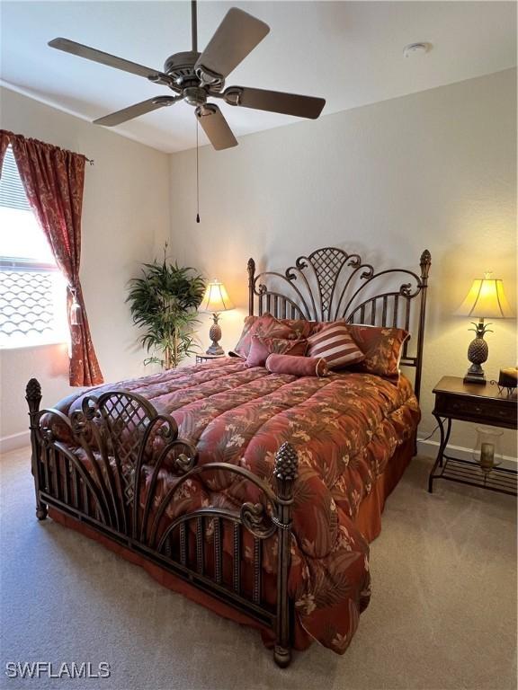 carpeted bedroom featuring ceiling fan