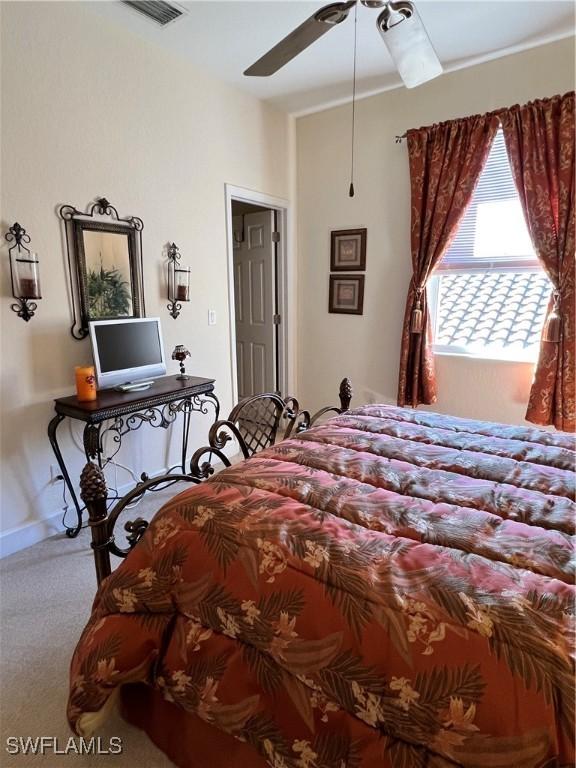 carpeted bedroom featuring ceiling fan