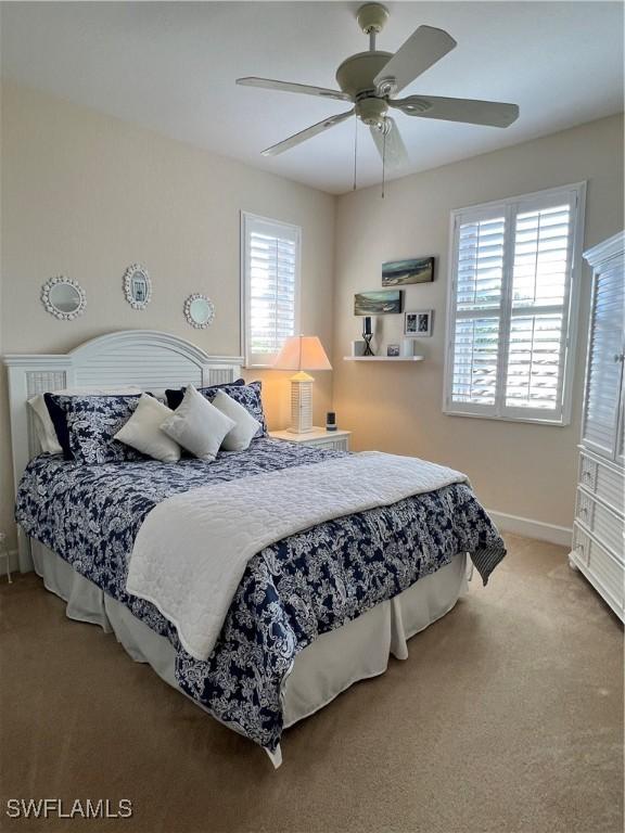 carpeted bedroom with ceiling fan