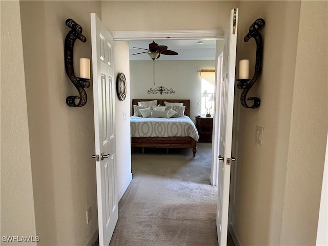 bedroom with ceiling fan and carpet flooring