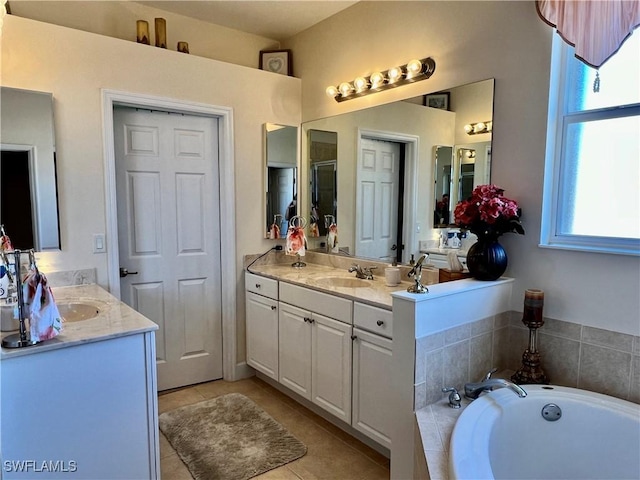 bathroom featuring vanity, tile patterned floors, and plus walk in shower