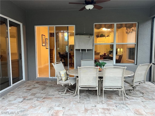 view of patio featuring ceiling fan