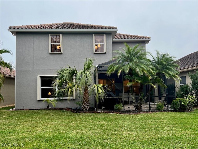 rear view of property with a patio area and a yard