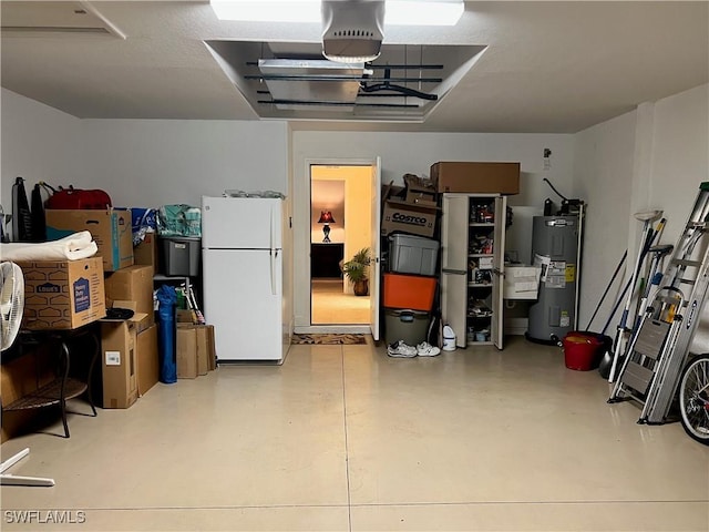 garage featuring electric water heater and white fridge