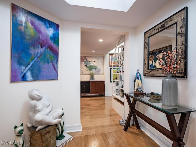 corridor featuring light hardwood / wood-style floors