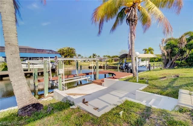 dock area featuring a yard and a water view