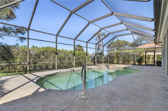 view of swimming pool with a patio area, a lanai, and a pool with connected hot tub