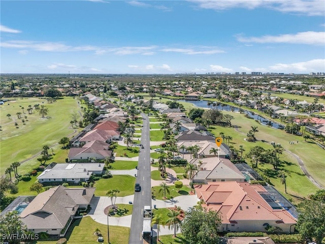 birds eye view of property with a residential view and golf course view