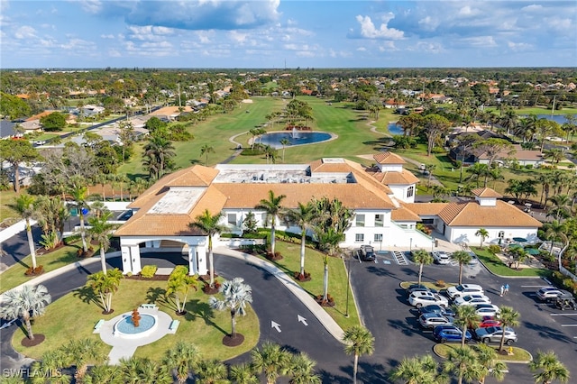 drone / aerial view with a residential view and golf course view