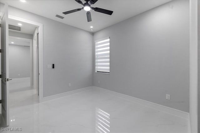 spare room featuring ceiling fan