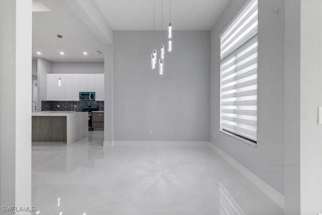 unfurnished dining area featuring a healthy amount of sunlight