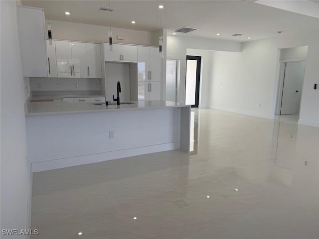 kitchen with white cabinets and sink