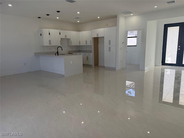 kitchen with sink and white cabinetry