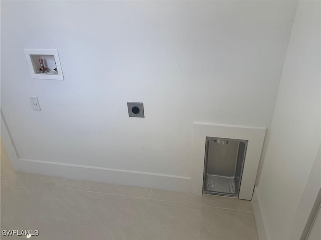 laundry room featuring light tile patterned flooring, hookup for a washing machine, and electric dryer hookup