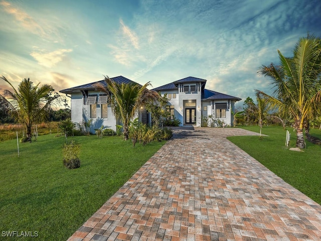 view of front of home with a yard