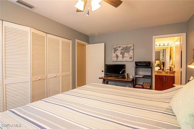 bedroom featuring ceiling fan, ensuite bath, and a closet