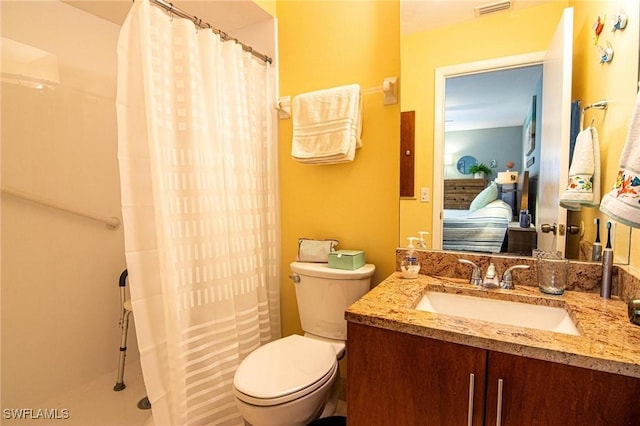 bathroom with toilet and vanity