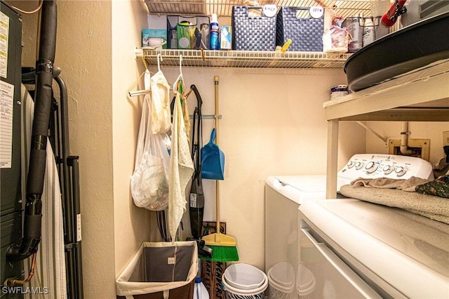 clothes washing area featuring separate washer and dryer