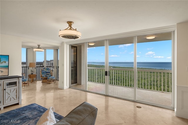 interior space featuring floor to ceiling windows, a water view, and a healthy amount of sunlight