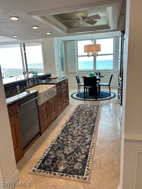 6573 Marissa Loop Unit 2004, Naples, FL 34108 - kitchen featuring dishwasher, a ceiling fan, a sink, ornamental molding, and a tray ceiling