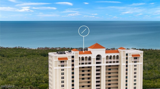 6573 Marissa Loop Unit 2004, Naples, FL 34108 - view of building exterior featuring a water view
