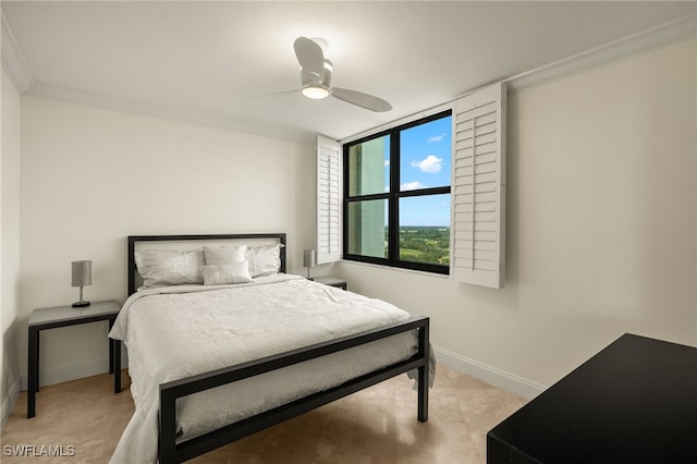 bedroom featuring baseboards, ceiling fan, and crown molding