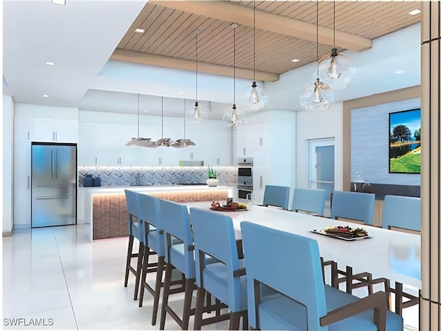 6573 Marissa Loop Unit 2004, Naples, FL 34108 - kitchen featuring stainless steel appliances, light tile patterned flooring, decorative light fixtures, a kitchen bar, and recessed lighting